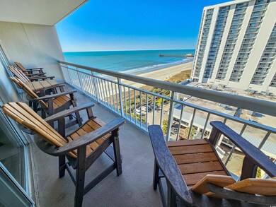 Balcony featuring a water view and a view of the b