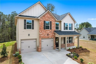 View of front of property with brick siding, cover