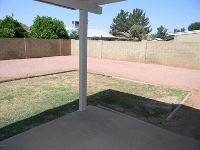 Large rear yard w/covered patio