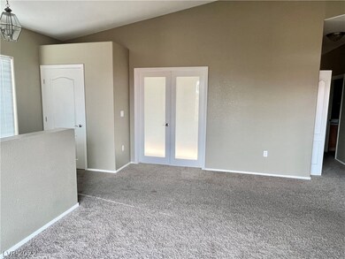 Double door entry into the secondary bedroom from