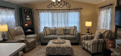 Living room featuring a wealth of natural light, crown molding, and vaulted ceiling