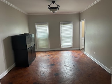 Unfurnished dining area featuring concrete floorin