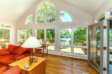 Wall of windows in the Great Room overlooking Lake