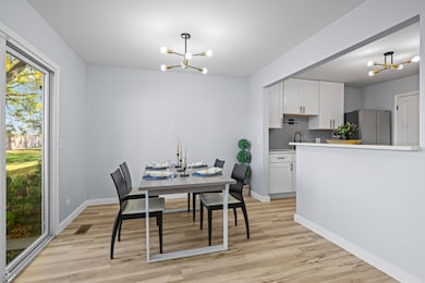 Adjacent to the kitchen, the dining space includes