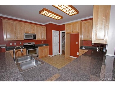 The kitchen has lots of cabinets with roll out dra