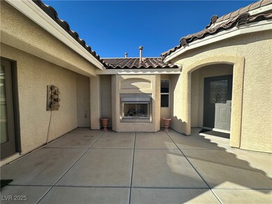 View of patio featuring an outdoor fireplace