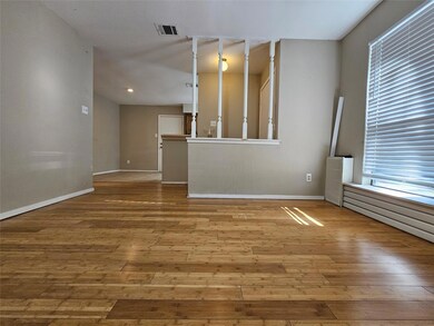 Spare room with hardwood / wood-style floors, bas