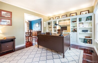 Custom built shelving and mahogany floors in the office