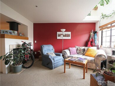 Living Room with Large Windows and Fireplace