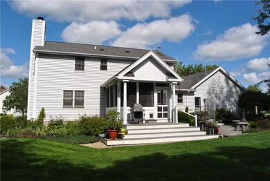 REAR VIEW OF HOME SHOWING SCREENED THREE SEASON SU