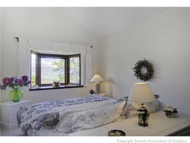 Master Bedroom. Check the ski conditions through t