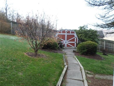 Storage shed included for lawn equipment, etc.