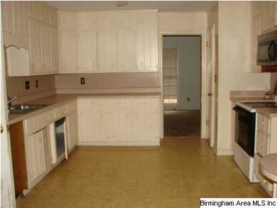 Another view of the kitchen, door to dining room o