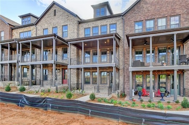Back of property featuring a balcony