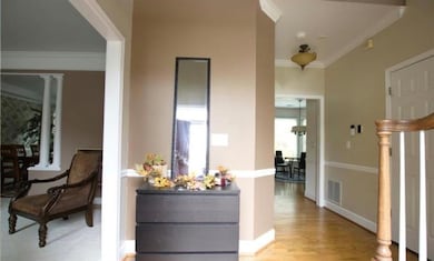 Corridor featuring and light wood-style floors