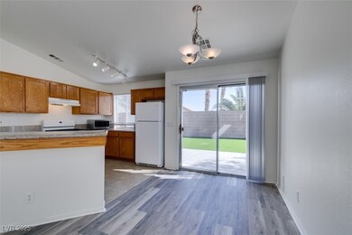 Kitchen featuring visible vents, under cabinet ran