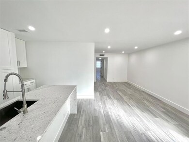 OVERLOOKING KITCHEN AND LIVING ROOM