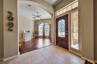 A flex room off the foyer offers a wonderful space for a home office or playroom.