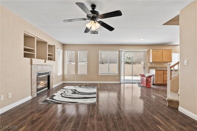 Unfurnished living room featuring baseboards, a ti
