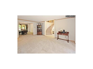 Living room opening left of foyer. Dining room bey
