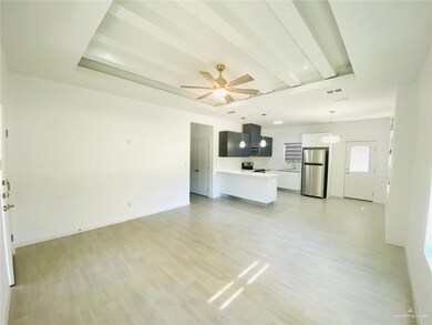 Unfurnished living room with light wood finished floors and a ceiling fan