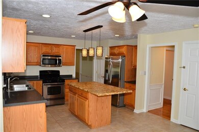The dining room is top center in the photo and the hallway leading to the Half Bath is right center in the photo.