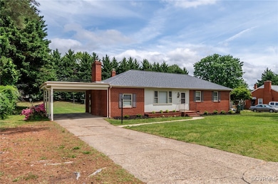 Ranch-style house with a front lawn, brick siding,