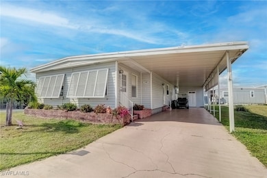 View of front of home featuring a carport and a fr