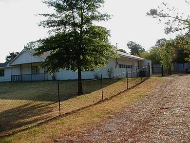 Exterior Front. Home sits back off road.