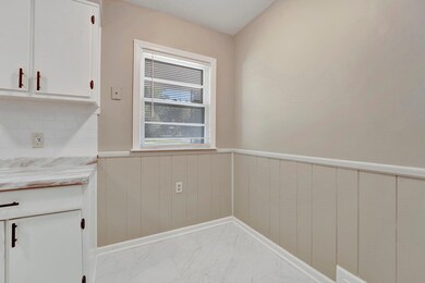 Kitchen with white cabinetry