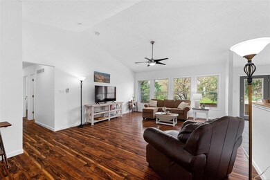 Soaring vaulted ceilings and easy care wood-look l