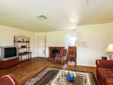 Living room along with view of fireplace.