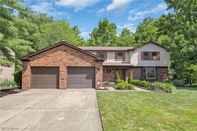 View of property with a garage and a front yard
