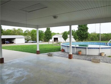 Here is a view from the carport looking down towards the Garage and Barn. 