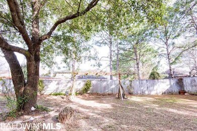 Fenced back yard with lots of shade!