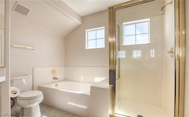 Full bathroom featuring a bath, a stall shower, to