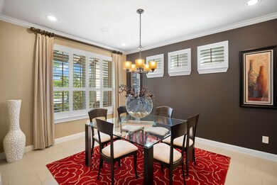 Plantation shutters have been added across the front of the house.