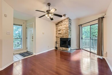 Unfurnished living room featuring wood finished f