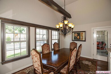 Another view of the breakfast room with beamed cei