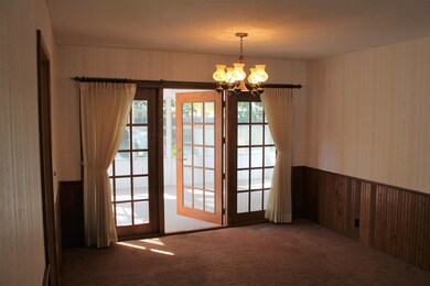 Spacious dining area with 3 seasons room and backy