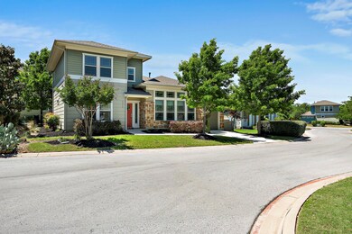 View of front of home with a front yard, driveway