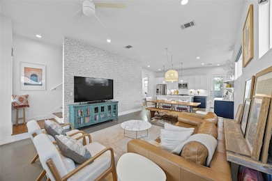 Living area with recessed lighting, ceiling fan, 