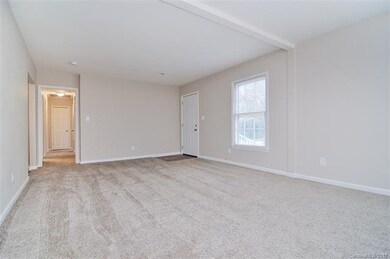 Open concept floor plan leading you to the kitchen
