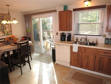 This view of the kitchen shows the dining area and