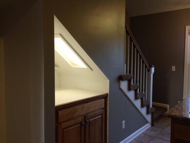 Small kitchen alcove and steps leading to two huge