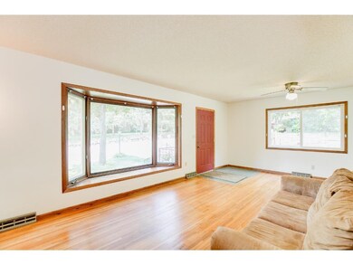 Gleaming hardwood floors, bay window, 2 sliding do