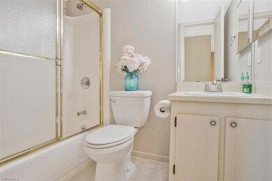 guest bath with tub shower combo and shower doors