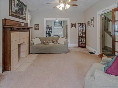 Living Room with decorative fireplace flanked by s