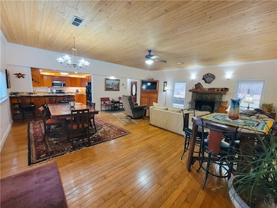 Dining area and living room looking from the hallw