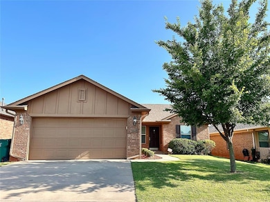 Ranch-style house with an attached garage, brick siding, concrete driveway, a front lawn, and board and batten siding